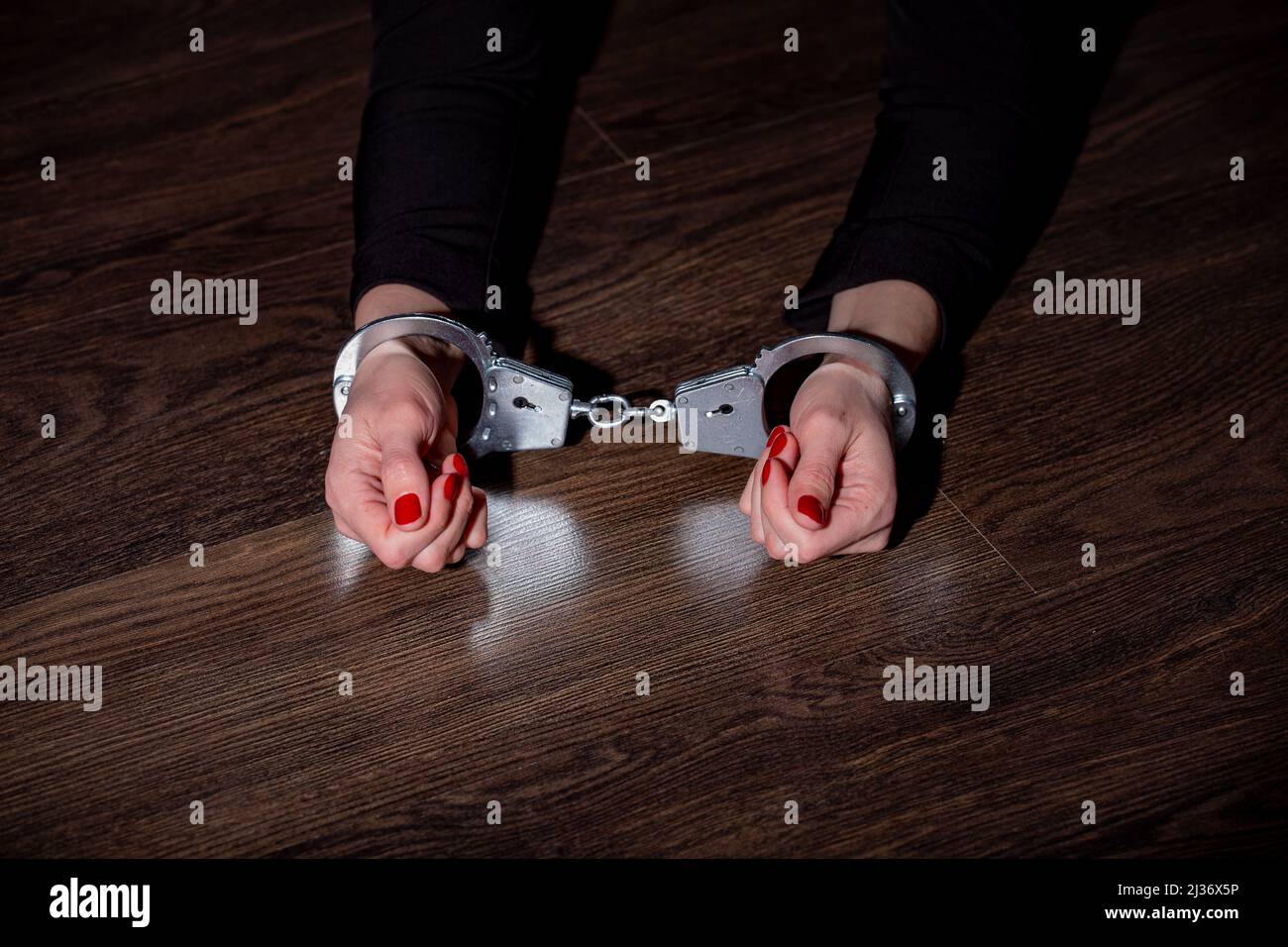 women's hands in handcuffs Stock Photo Alamy