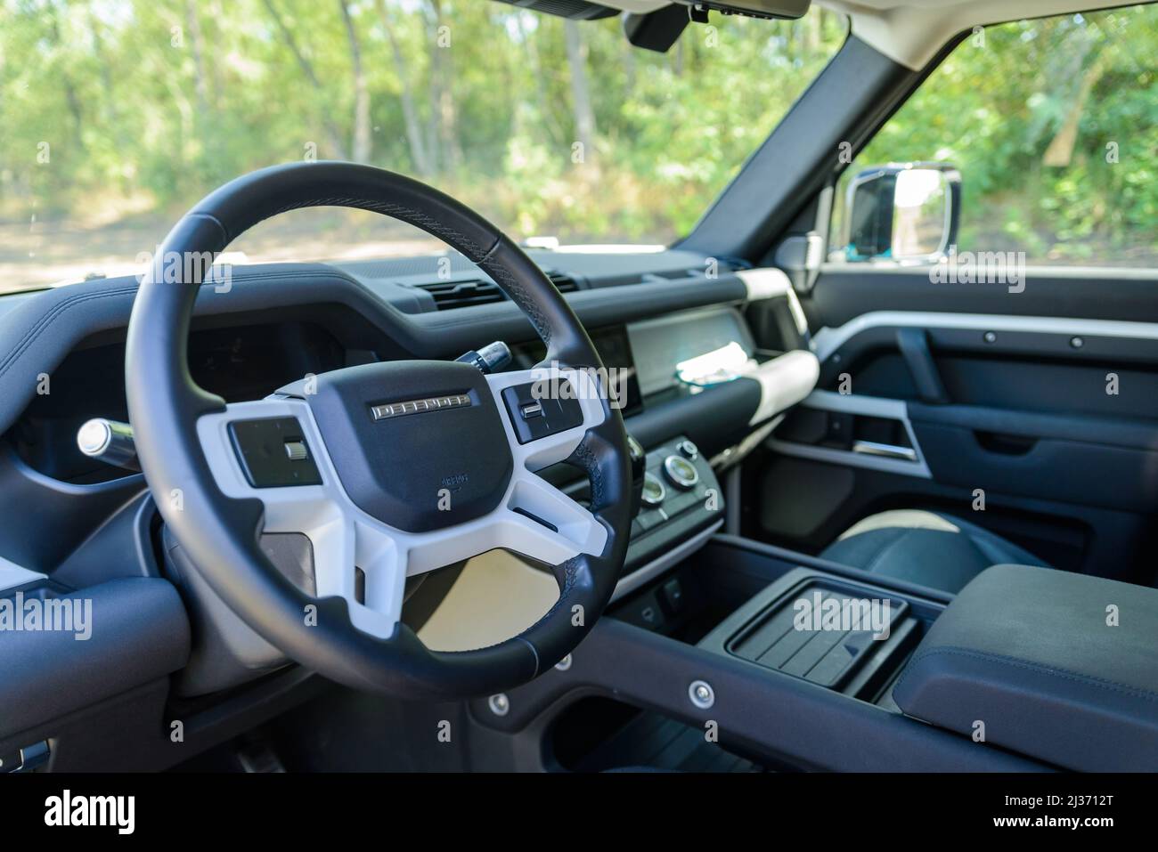 Russia, Rostovskaya oblast, 2021 June 09: Steering wheel of Land Rover Defender is a four-wheel drive off-road SUV from British automotive company Jag Stock Photo