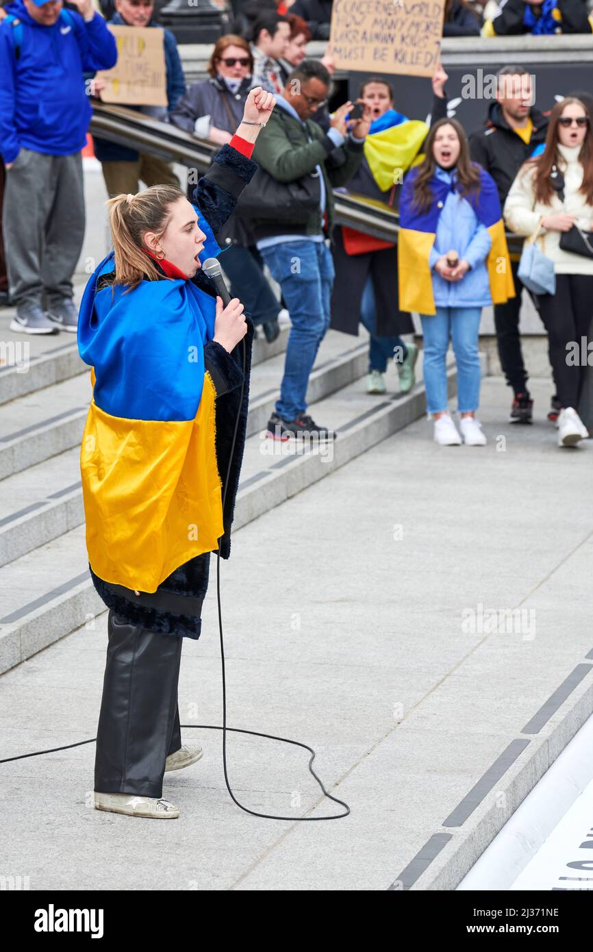 Addressing the crowd dressed in Ukrainain flag Stock Photo