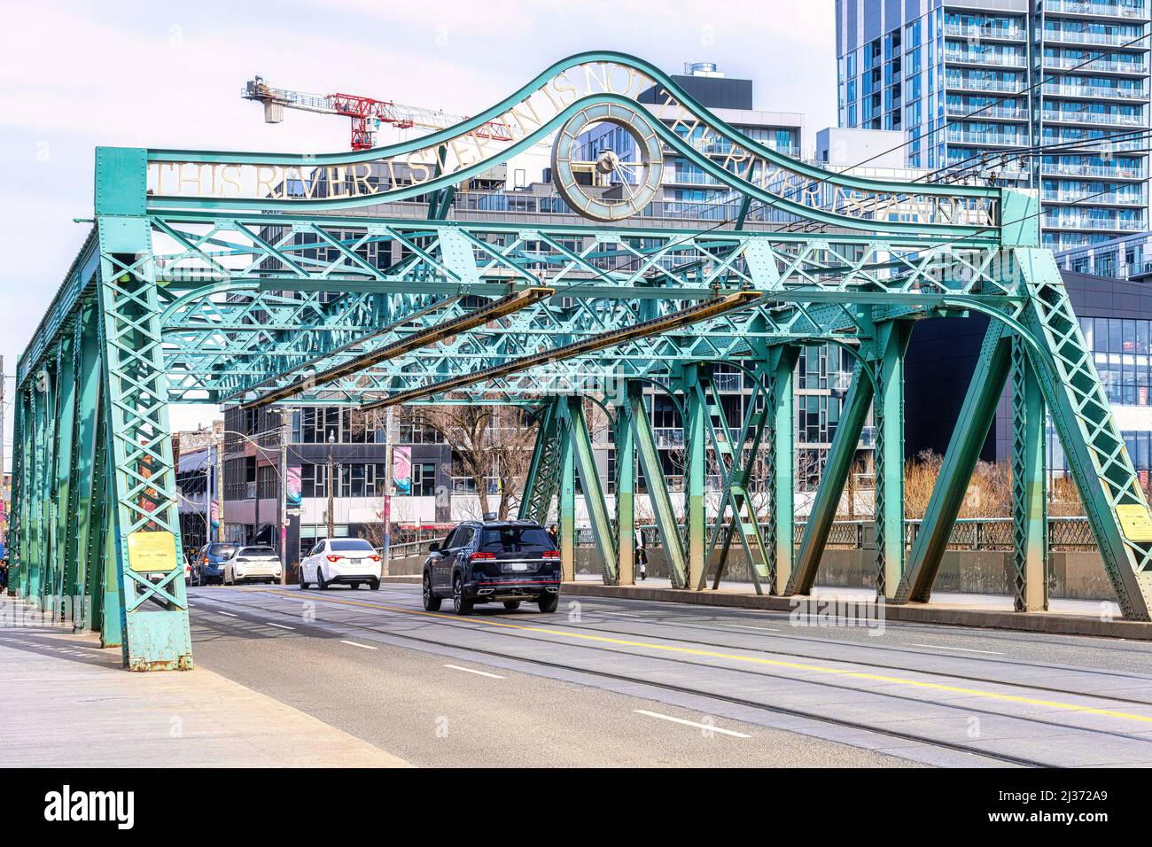 Metallic Pratt truss bridge known as the Queen St. Viaduct (1911). The old structure is an iconic view in the city which is the capital city of the On Stock Photo