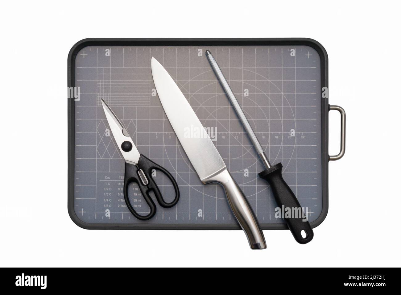 Various kitchen knives, scissors and cutting board Stock Photo Alamy