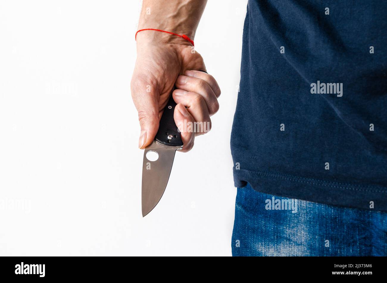 The man using folding knife. Close up folding knife in hand Stock Photo