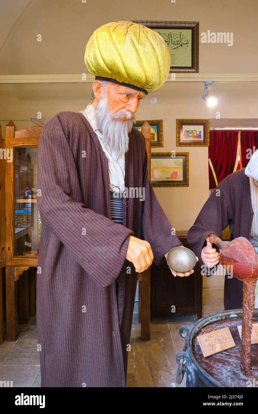 A diorama of a old man figure, a pharmacist,  supervising the mixing of a drug. At the Medical History Museum in Manisa, Turkey. Stock Photo