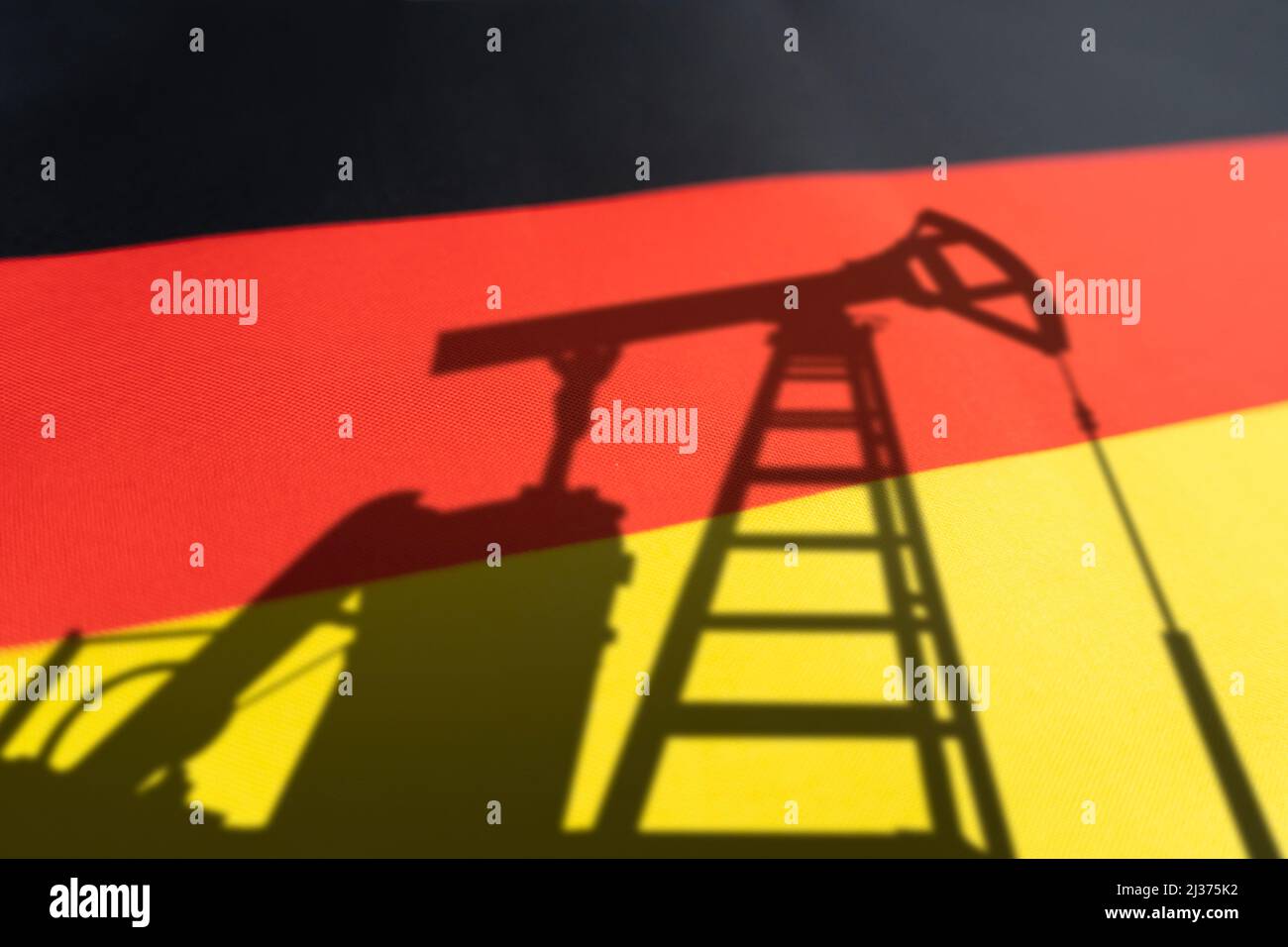 purchase of oil in germany. Oil rigs on background of the german flag