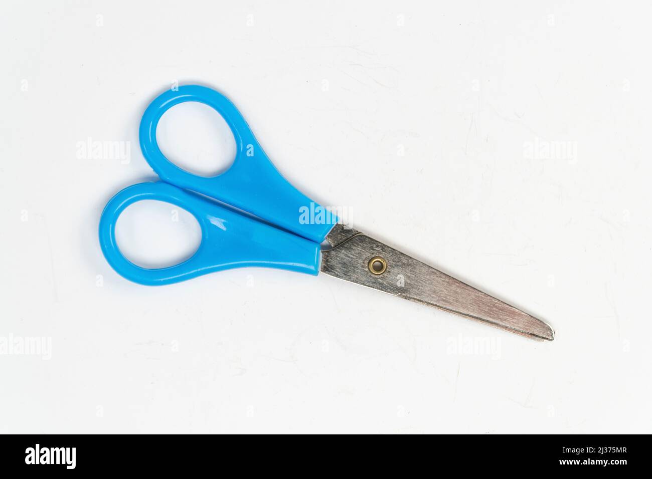 Blue scissors isolated on white background, small a pair of scissors, cutting tool top view Stock Photo