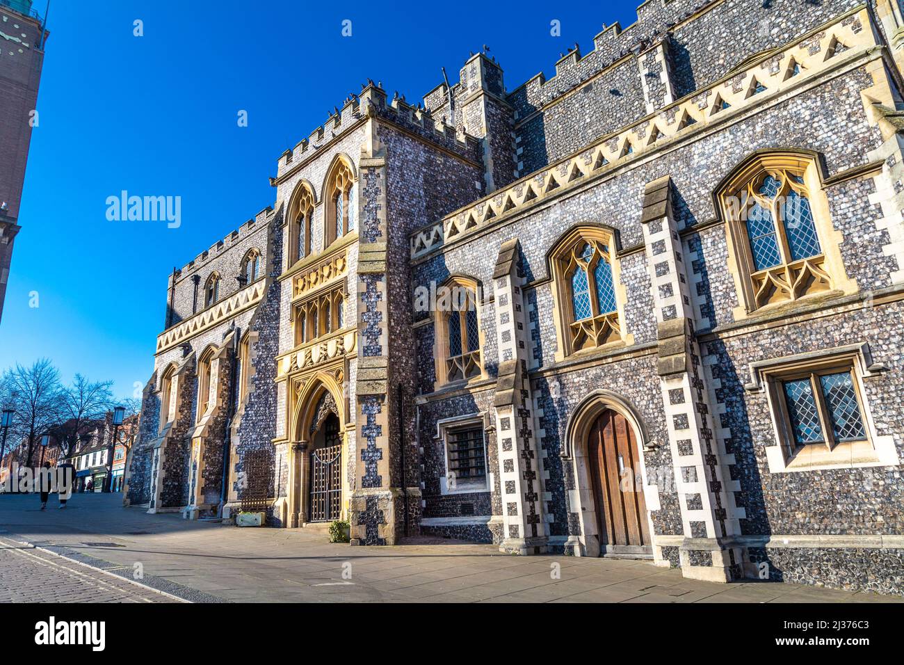 Flint facade of the medieval 15th century Norwich Guildhall with later inserted Victorian Gothis style windows, Norwich, Norfolk, UK Stock Photo