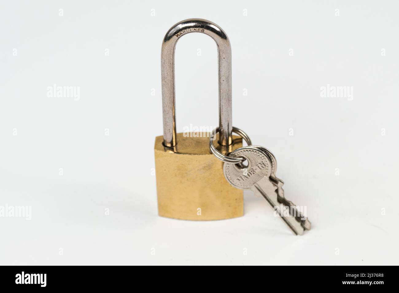 Steel tall padlock isolated on white background, locked padlock, solid safety top view Stock Photo
