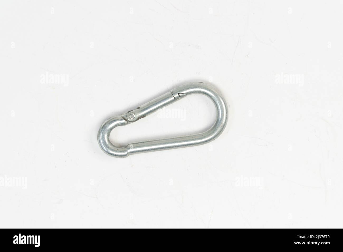 Mountain climbing snap hook clip isolated on white background