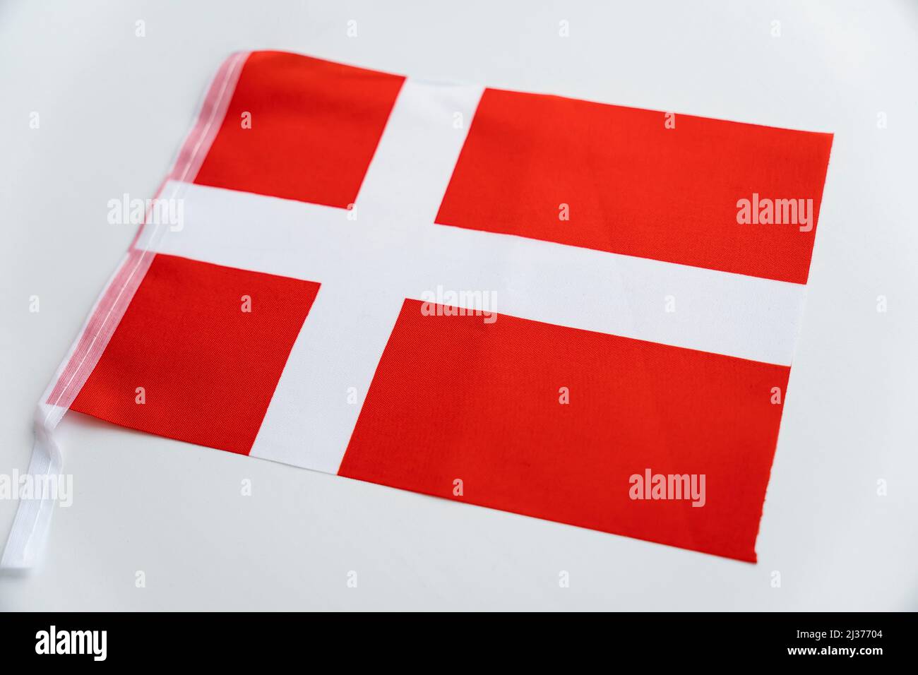 Flag of Denmark. Fabric flag of Russia on a white table Stock Photo