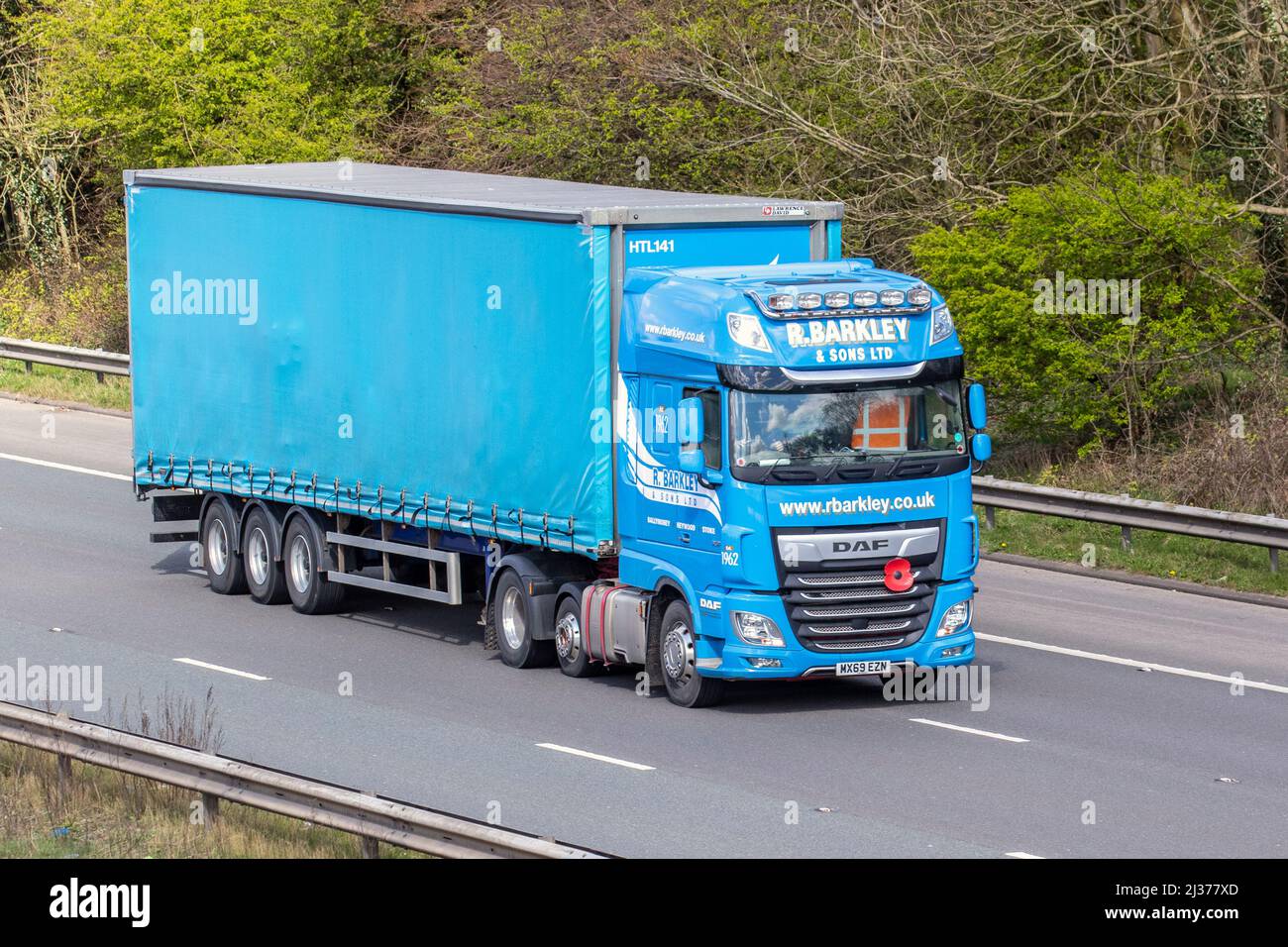 R Barkley & Sons Ltd DAF XF curtain-sided lorry ,curtainsider, tautliner, curtainsided, curtainside trailers driving on the M61 in Manchester, UJK Stock Photo