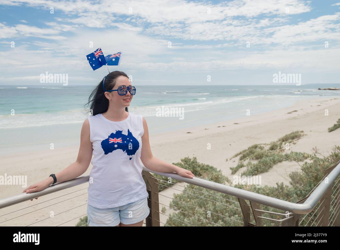 Young woman enjoyng the views of Seal Bay on Kangaroo Island, South Australia Stock Photo