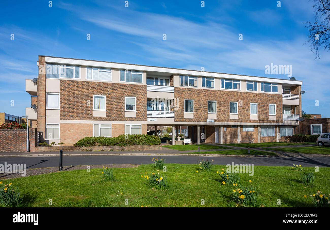 Rear of modern 3 storey block of flats / apartments in a private estate at Bramber Square, Church Farm Gardens, Rustington, West Sussex, England, UK. Stock Photo