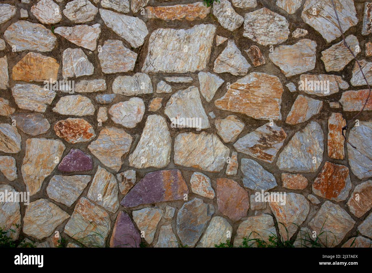 Stonewall background. A stone wall made using concrete. Close up. Stock Photo