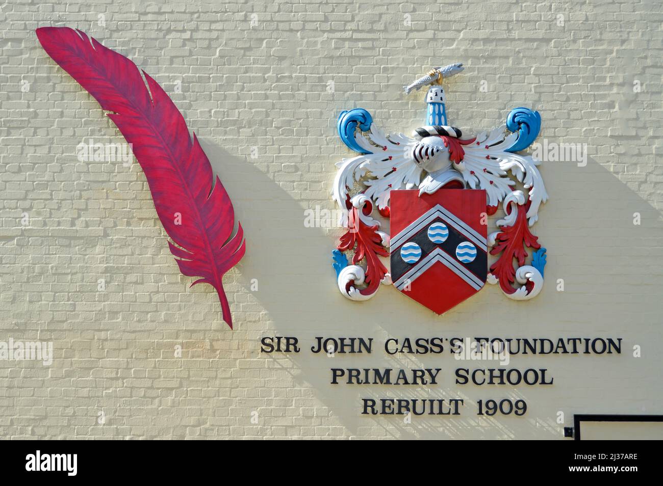 Coat of Arms of Sir John Cass's Foundation Primary School & symbolic red feather linked to John Cass an education benefactor to this day in London UK Stock Photo