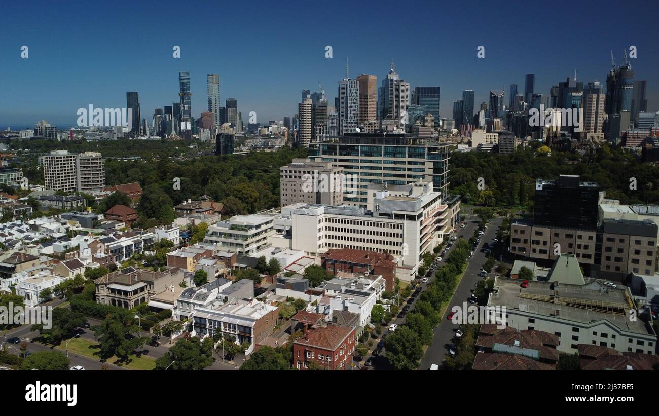 Aerial photo of East Melbourne hospital precinct and Fitzroy Gardenswith Melbourne CBD in background Stock Photo