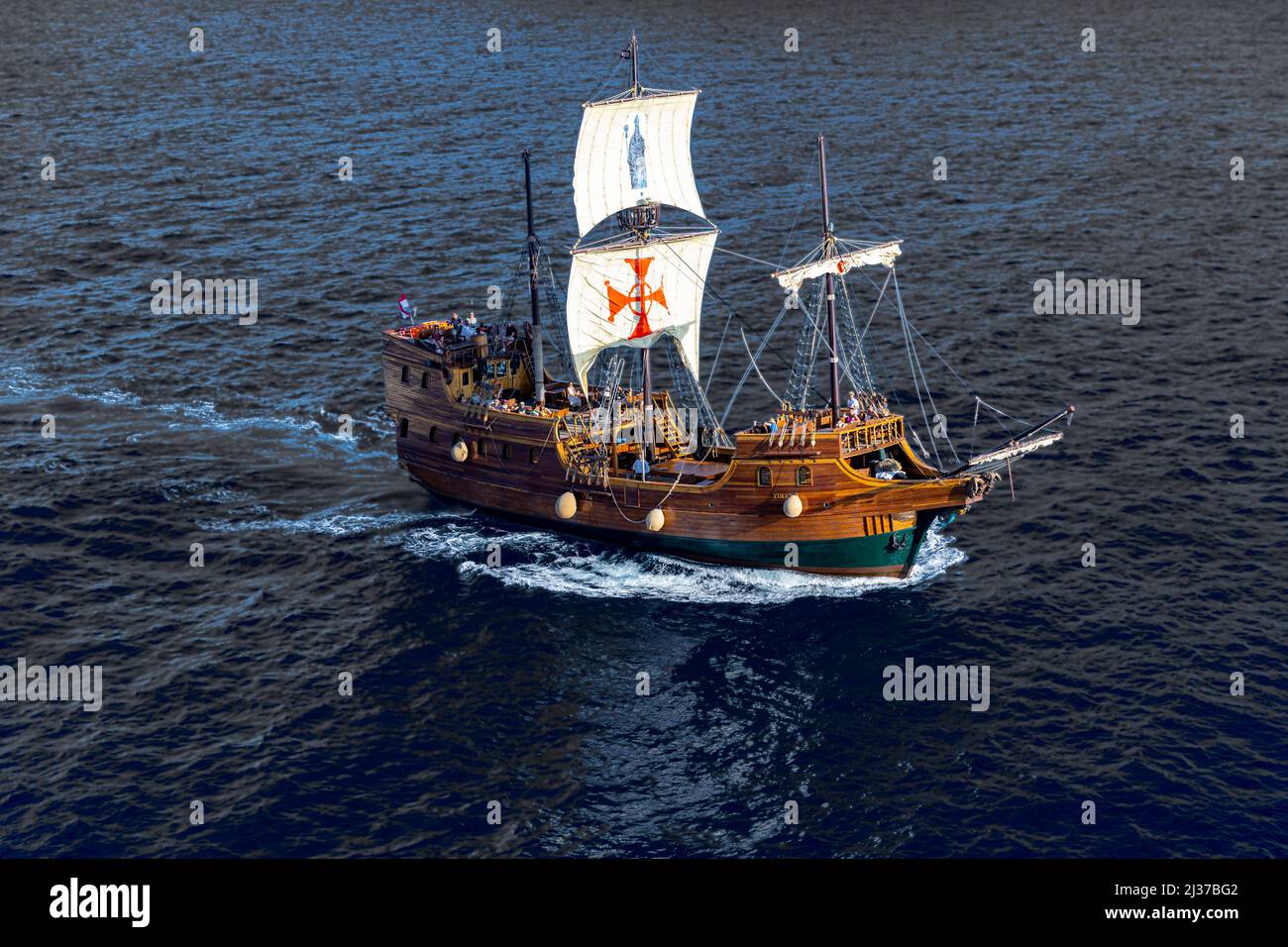 The beautiful three-masted boat named Tirena sailing in the Adriatique sea view from the rampart of dubrovnik fortified town Stock Photo