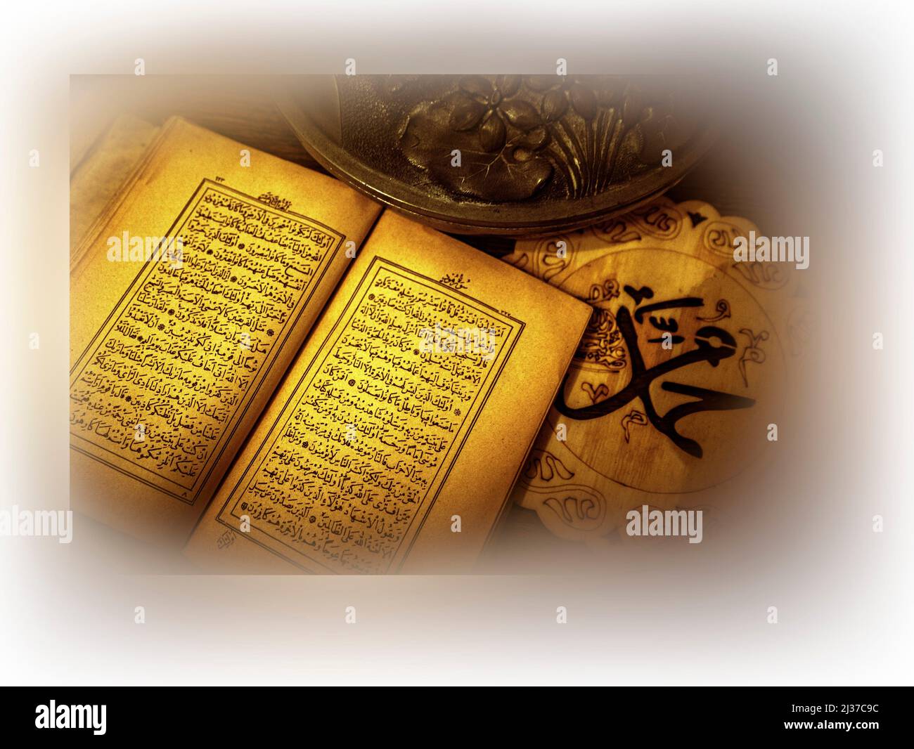 Religion Islam, the Holy Quran. (Framed). Qur'an or Koran, is the central religious text of Islam, believed by Muslims to be a revelation from God Stock Photo
