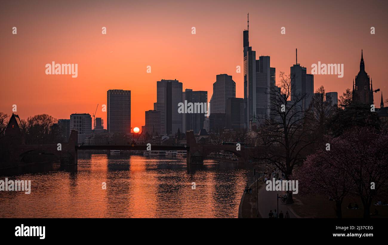 A scenic view of old bridge with buildings background in Frankfurt am Main, Germany during