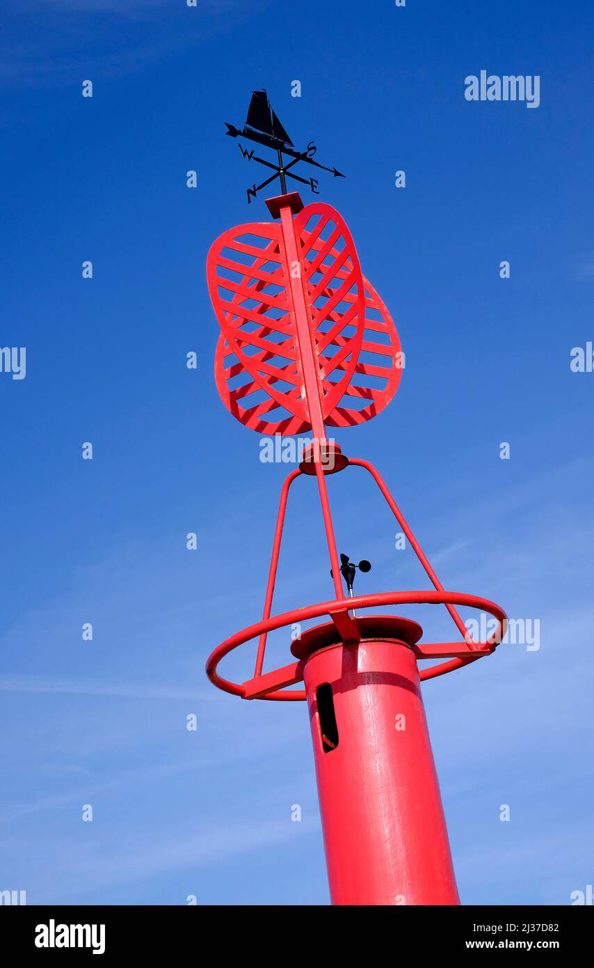 weather vane on top of red marker buoy, blakeney, north norfolk, england Stock Photo