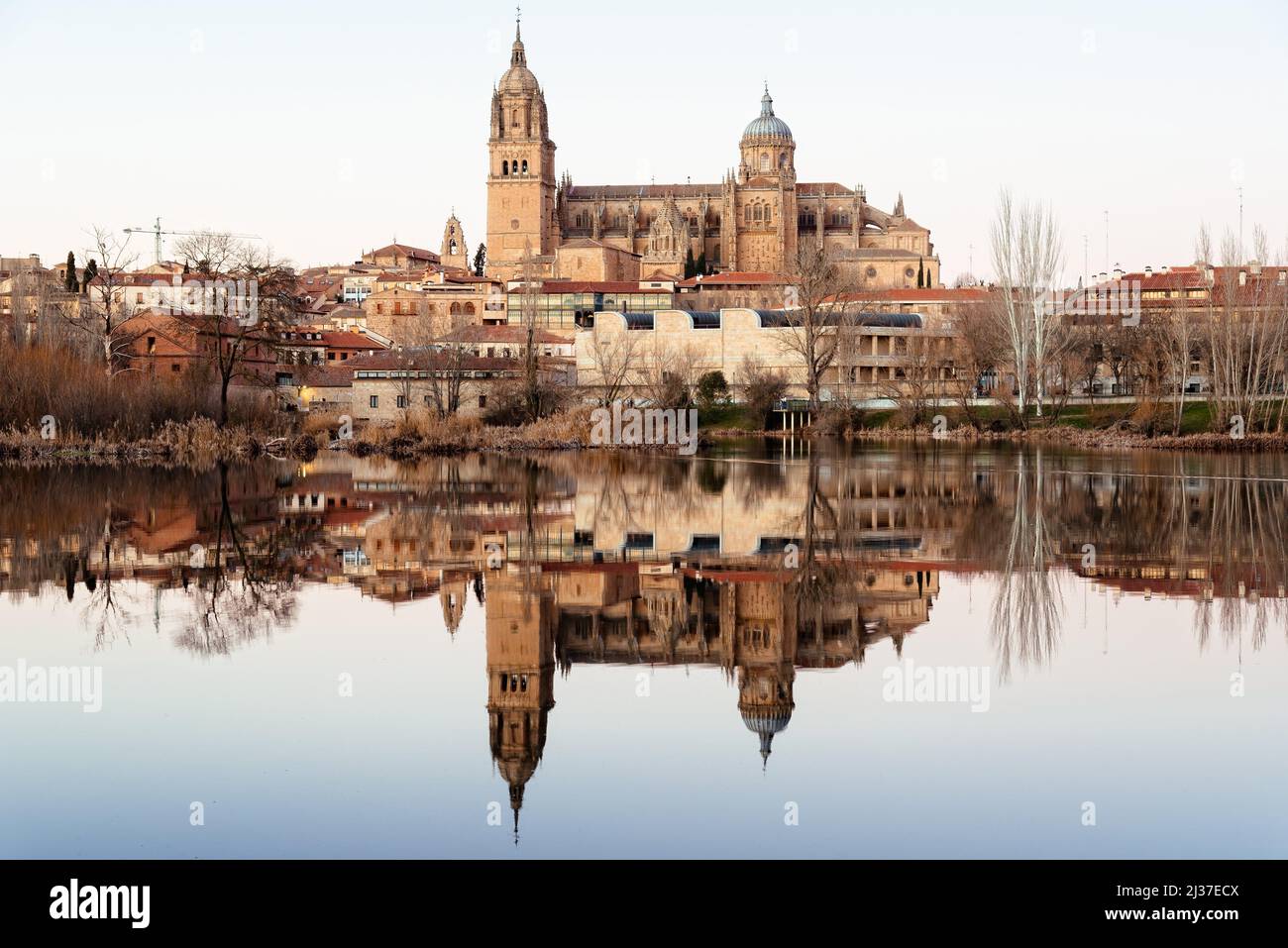 Landscape of the city of Salamanca and its cathedral reflected in the calm waters of the Tormes River. Stock Photo