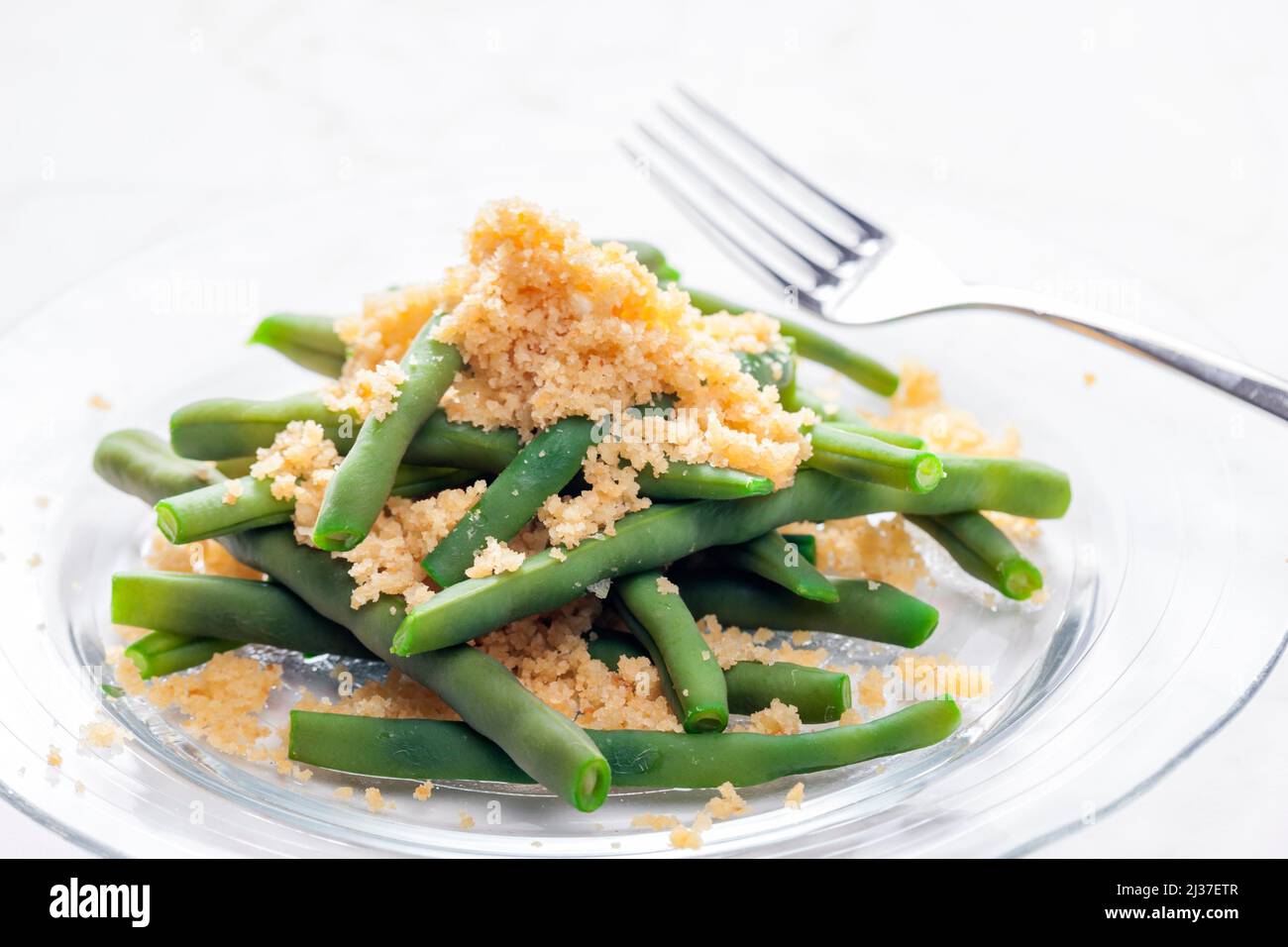 green beans served with bread crumbs Stock Photo Alamy