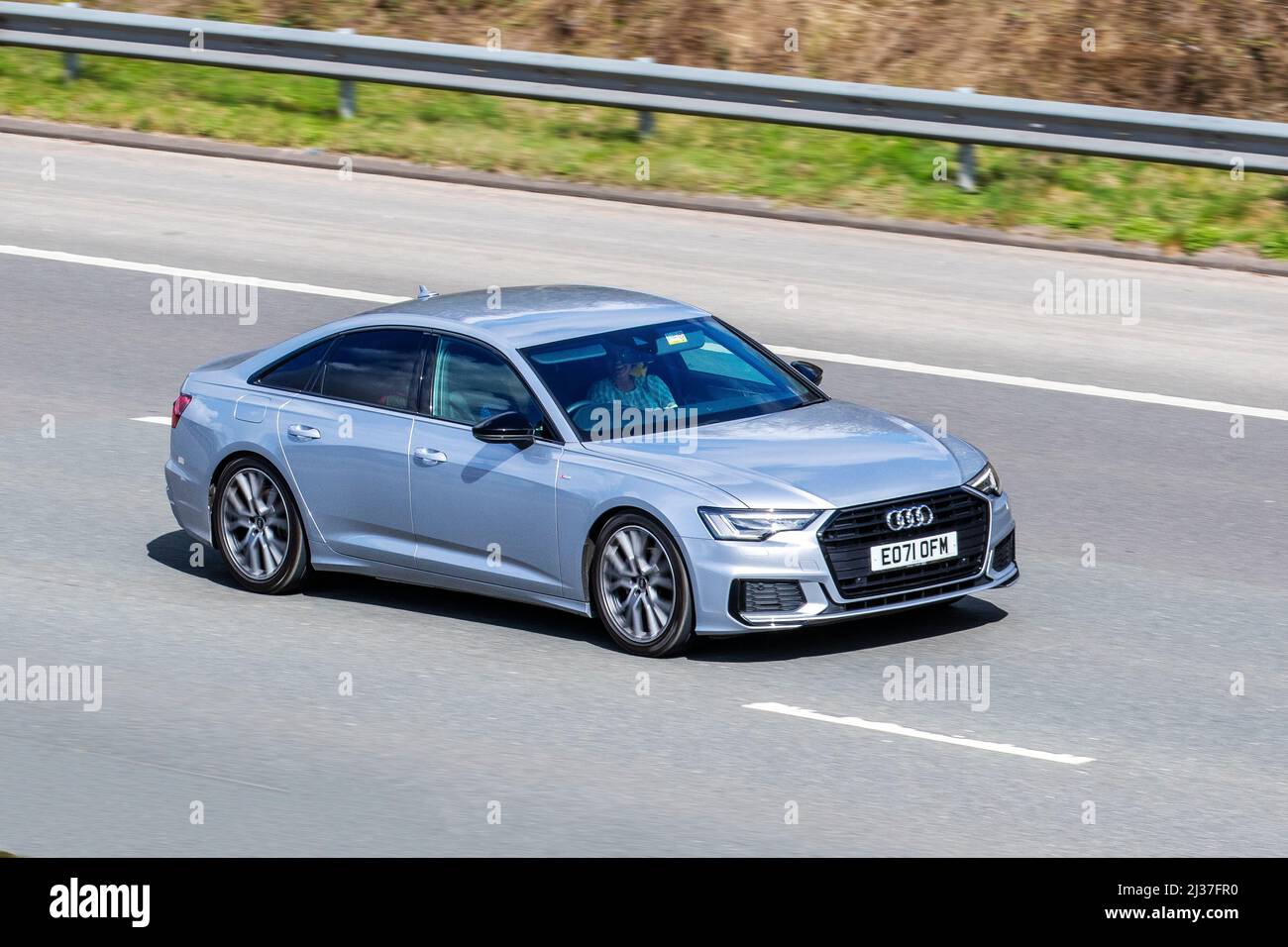 2021 Silver Audi A6 S LINE BLACK ED 40 TRI SA Edition; driving on the M61 Motorway, UK Stock Photo