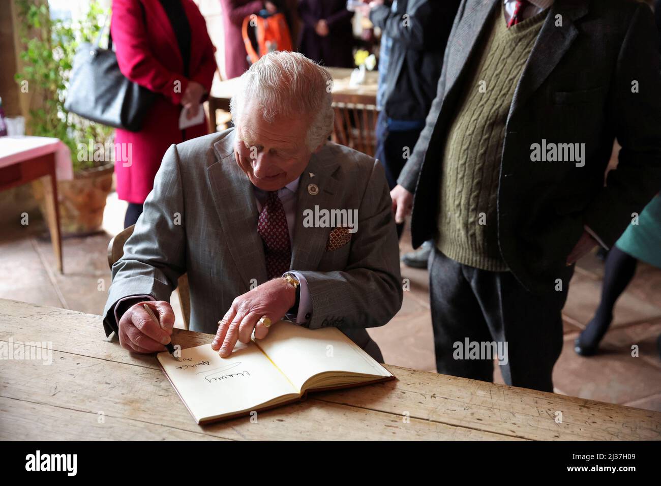 The Prince of Wales signs a book as he meets with trustees of the Newton Rigg agricultural college in Cumbria. Picture date: Wednesday April 6, 2022. Stock Photo