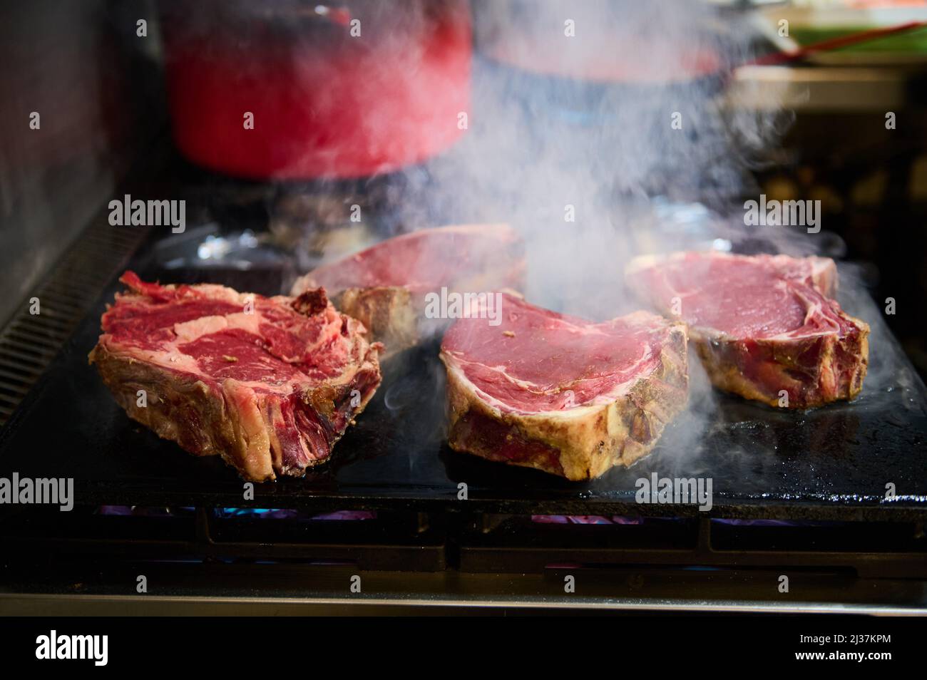 Thick beef steaks on the grill Stock Photo Alamy