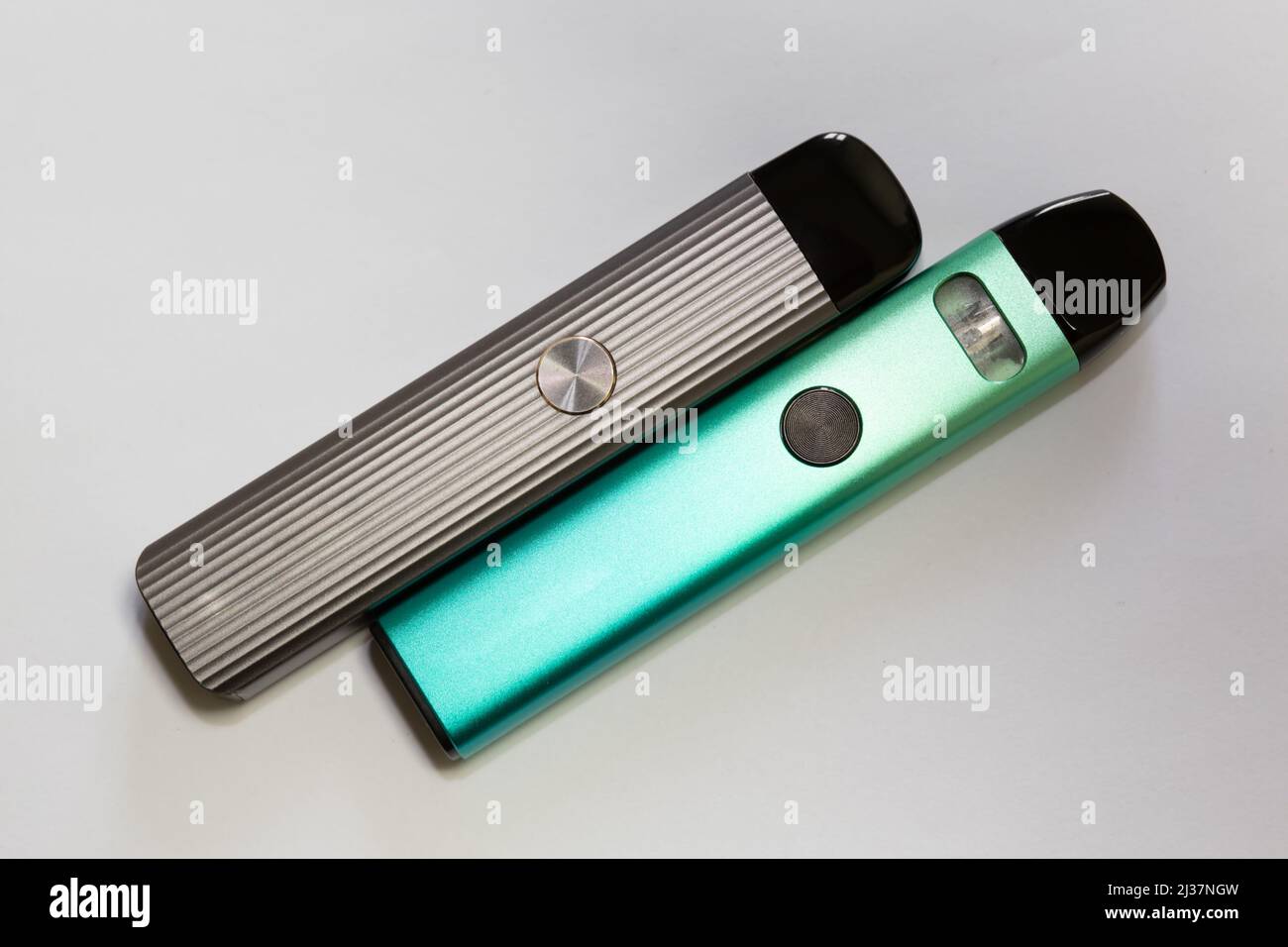 New system electronic cigarettes. Vape pod system or pod mod. Small and lightweight nicotine vapor sticks with replaceable cartridges. Stock Photo