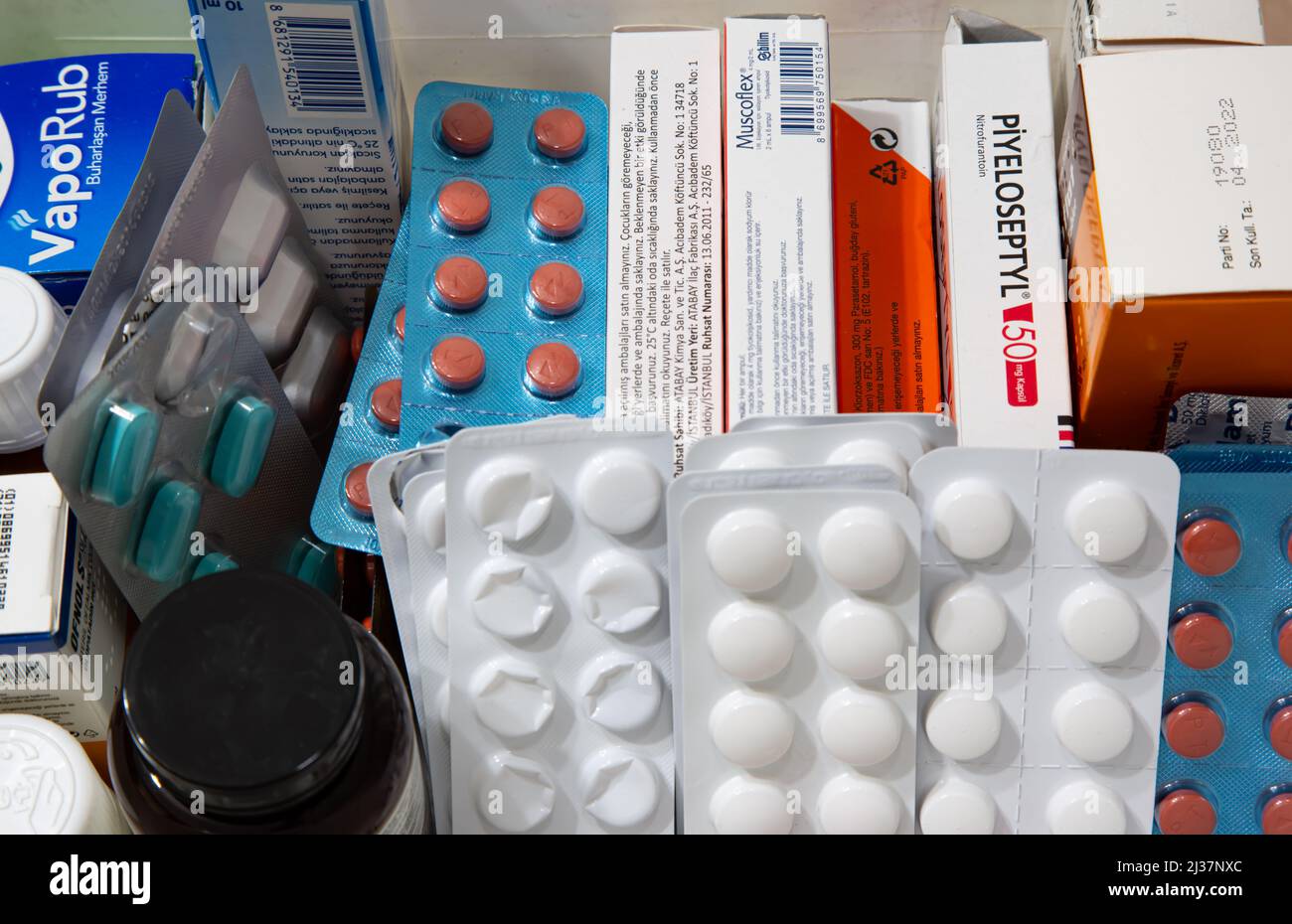Various drugs filled in boxes. Medicines in plastic tablets. Painkillers, antibiotics, ointments and liquid medicines from different trademarks. Stock Photo