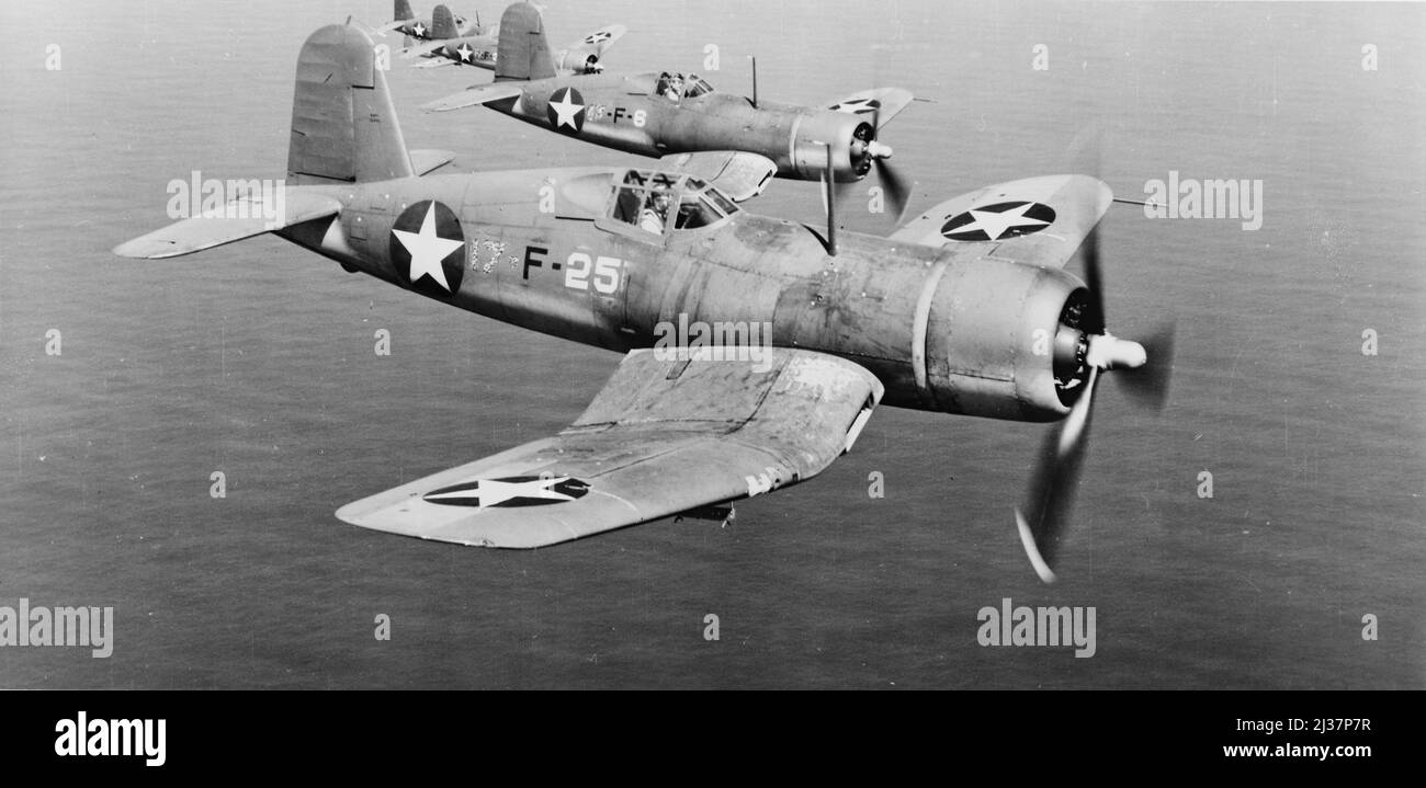 Aerial view of four U.S. Navy F4Us, Corsairs, in flight over South Pacific c. 1943. World War, 1939-1945. Air operations. Stock Photo