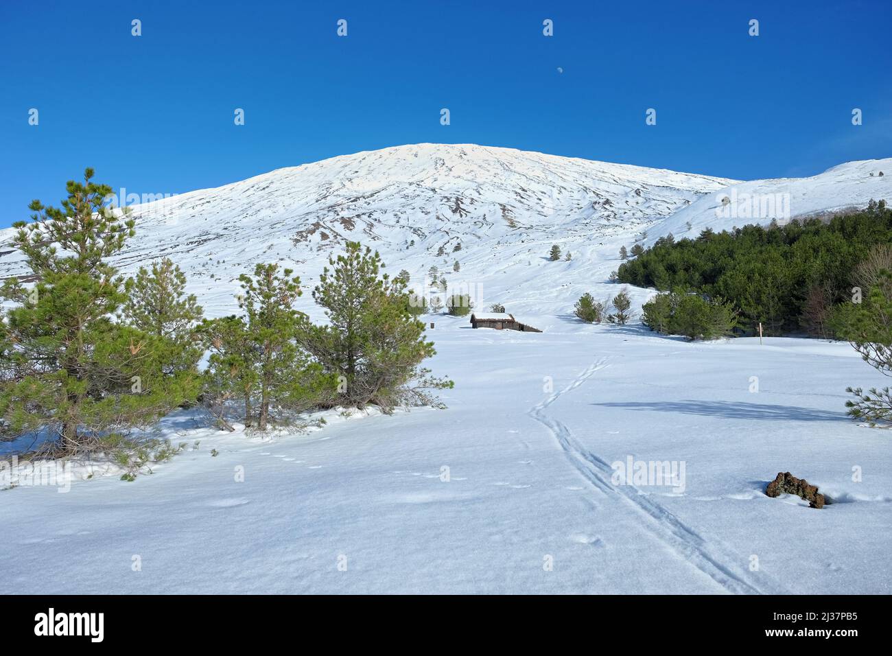 stone shelter in snow under top of Etna Mount, Sicily Stock Photo