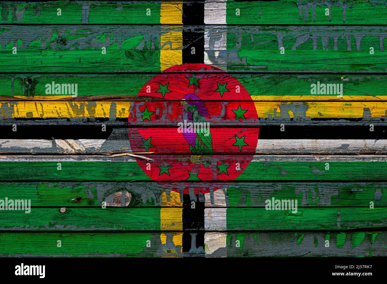 The national flag of Dominica is painted on uneven boards. Country ...