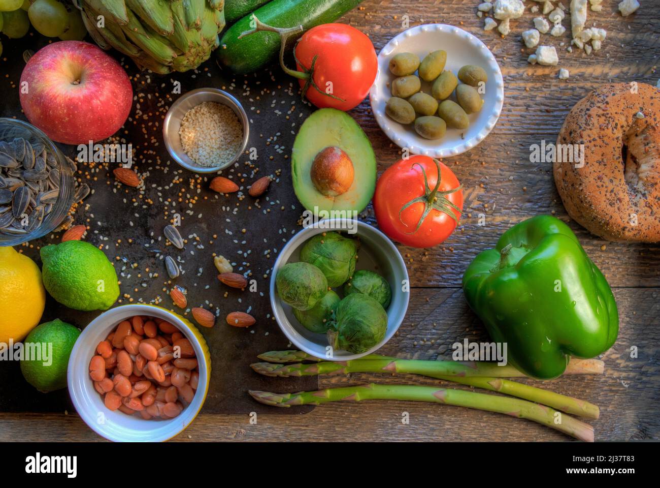 Mediterranean Diet food displayed on natural surfaces top view. Stock Photo
