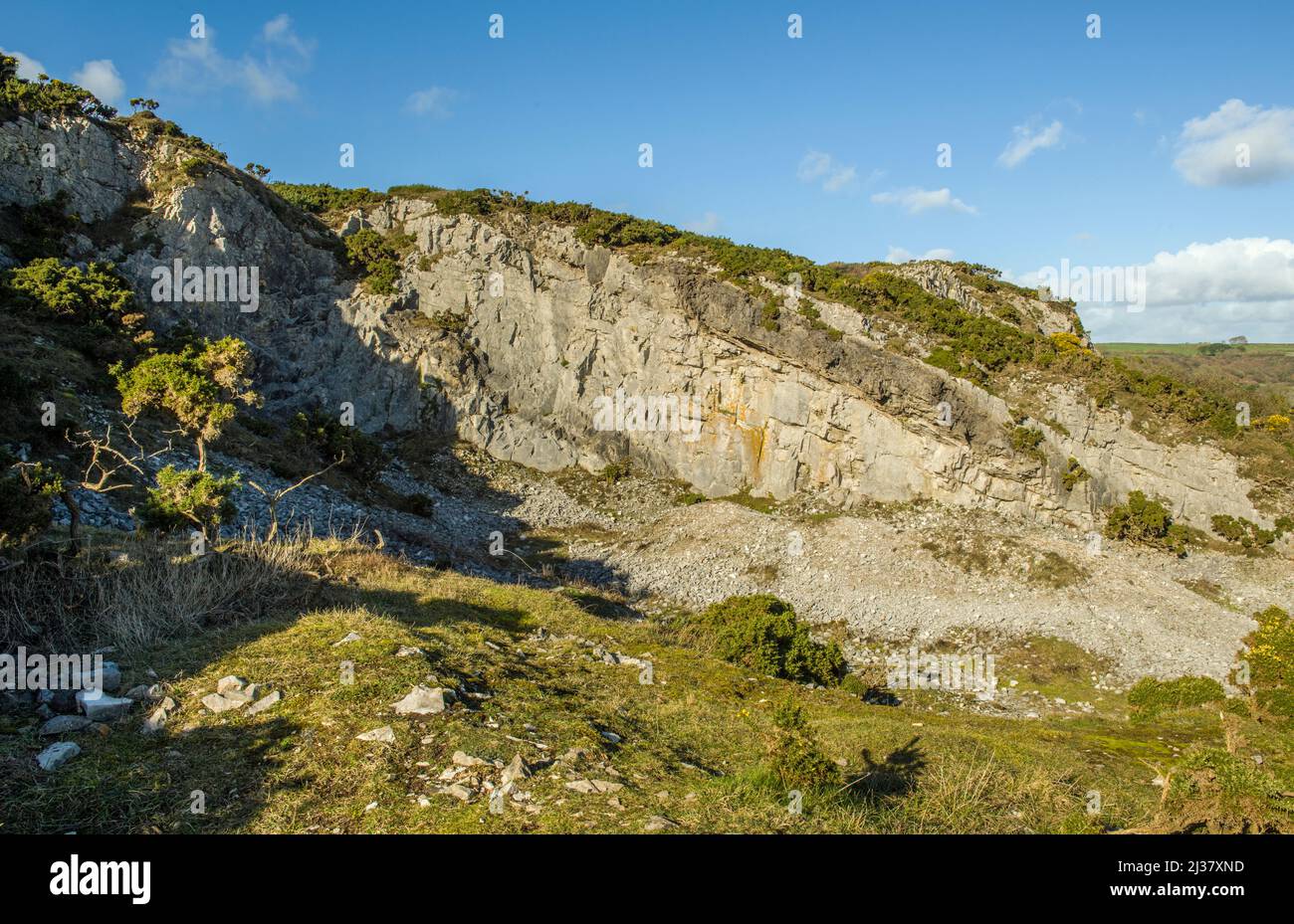Remains of a limestone Quarry at Port Eynon coast on the Gower Peninsula south Wales Stock Photo