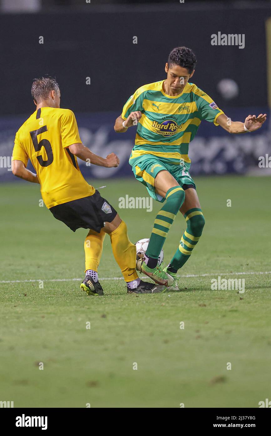 St. Petersburg, FL USA: Tampa Bay Rowdies defender Santi Castaneda (46) is  tackled by The Villages SC defender Austin Lukasik (5) during Round 2 of  the USL 2022 U.S. Open Cup, Tuesday,