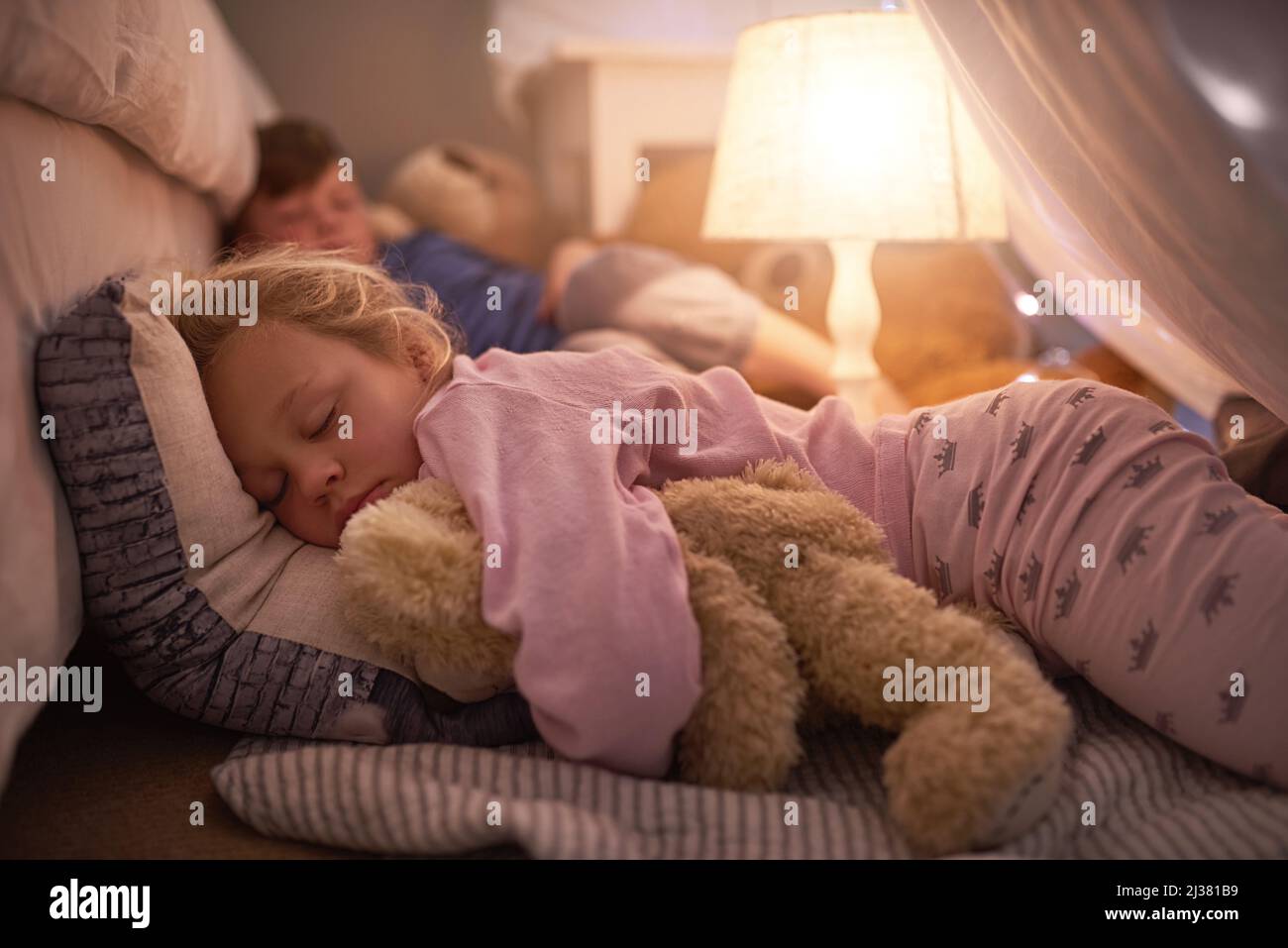 Sleeping tight with sweetdreams. Cropped shot of siblings sleeping