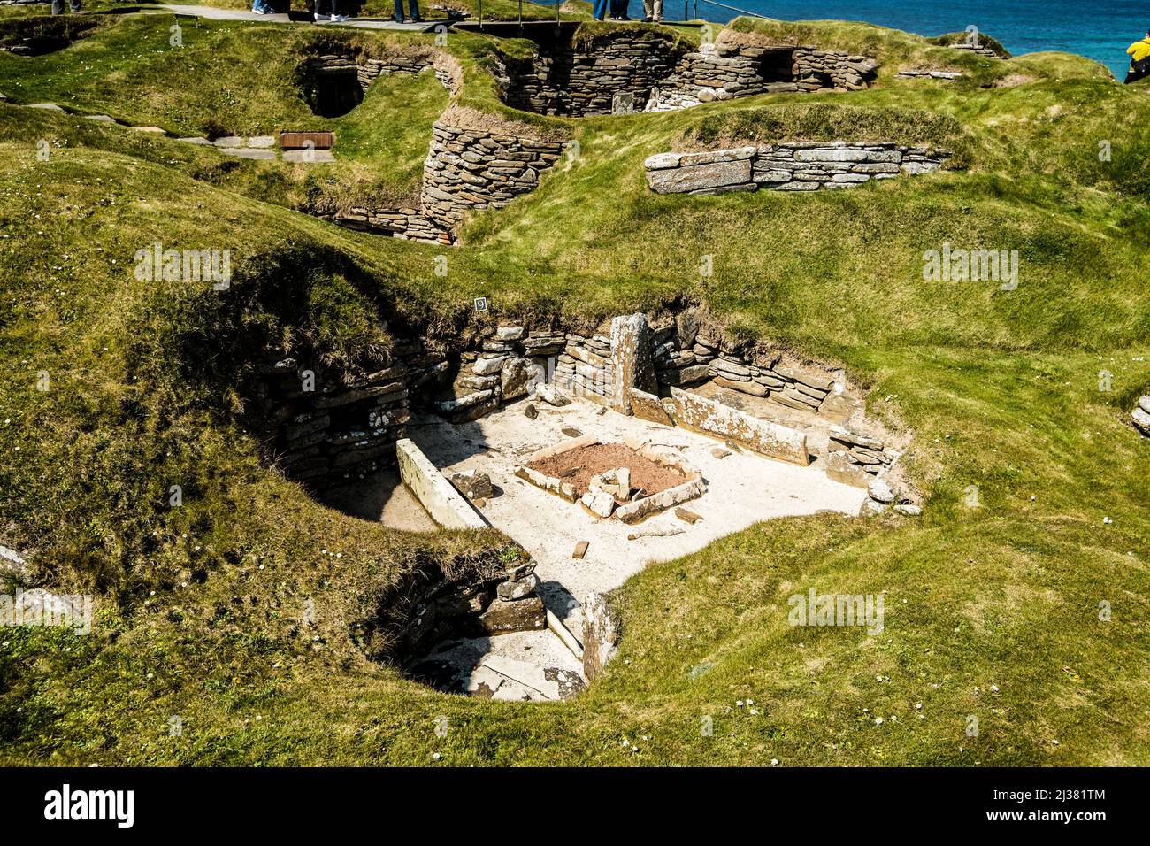 Early houses. Skara Brae Neolithic Archaeological Site. Bay of Skaill, Orkney Islands, Scotland, United Kingdom. Stock Photo
