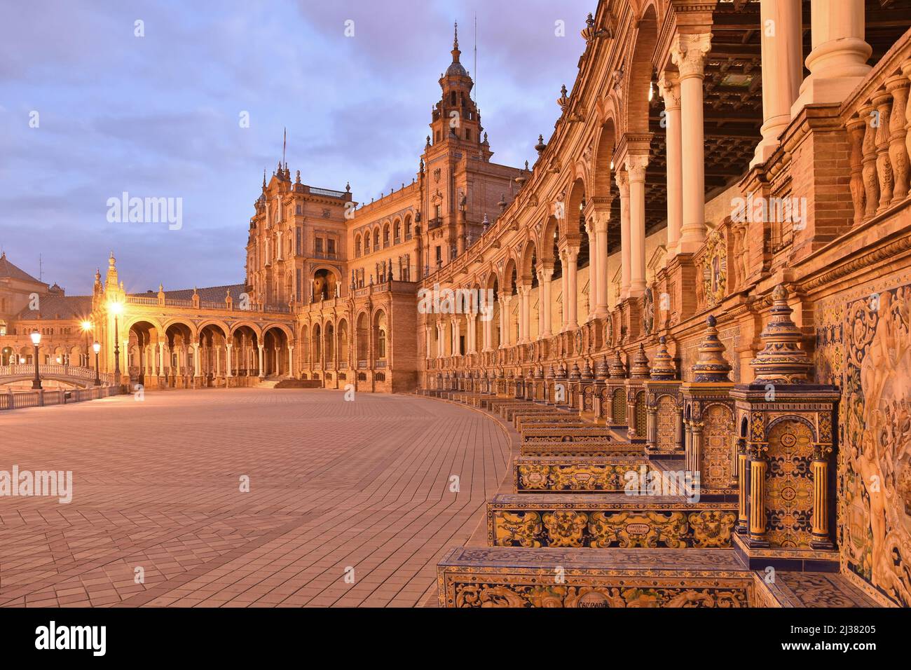 Plaza De Espana - Baroque, Renaissance and Moorish Revival styles architecture at dawn. Located at Maria Luisa Park in Seville Andalusia Spain. Stock Photo