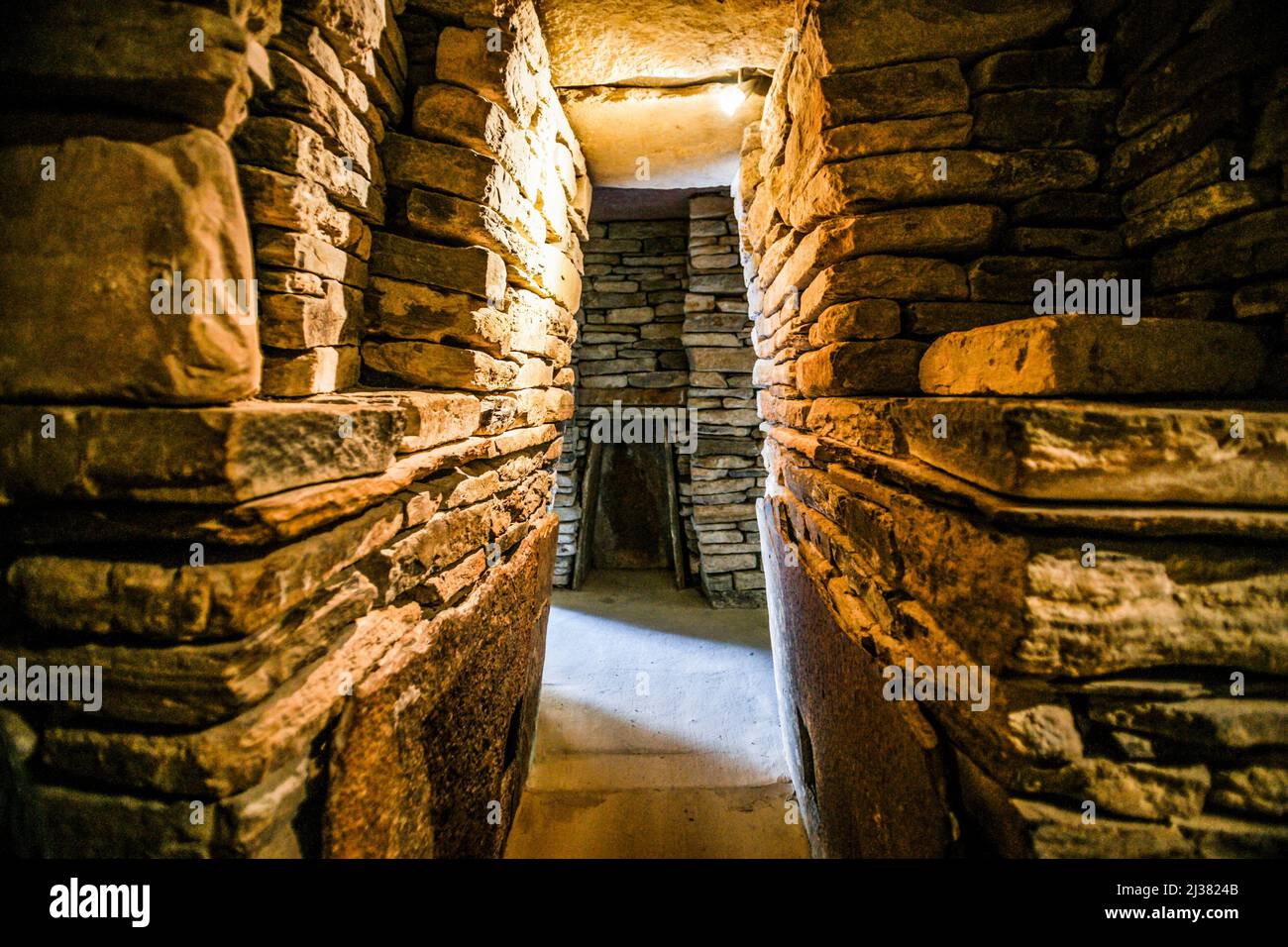 Interior of replica of a typical Skara Brae house. Skara Brae, Orkney Islands, mainland. Orkney Islands, Scotland, United Kingdom. Stock Photo