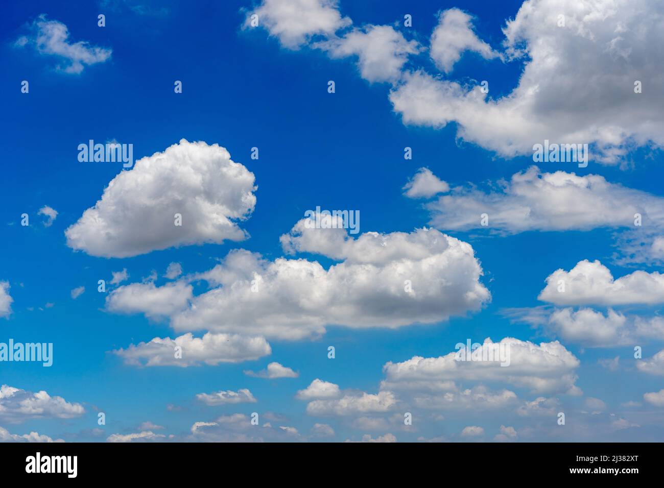 Amazing blue sky background with many white clouds floating Stock Photo ...