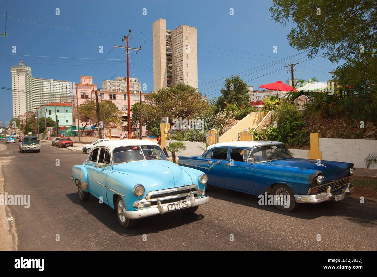 Old American cars in Hotel Zone-Zona Hotelera at Vedado district, La Habana, Cuba, West Indies, Central America. Stock Photo