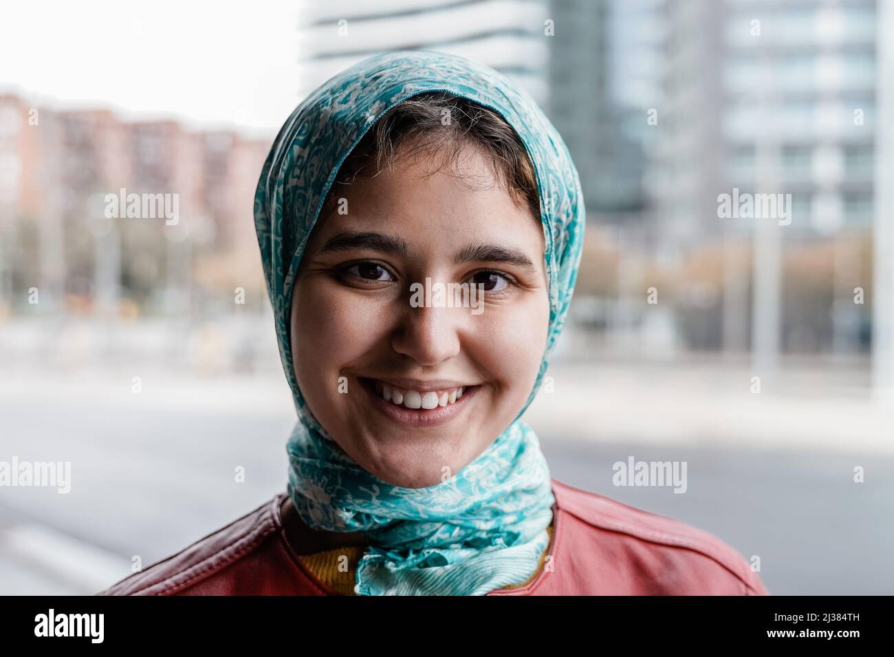 Happy Muslim girl smiling on camera outdoor - Focus on face Stock Photo