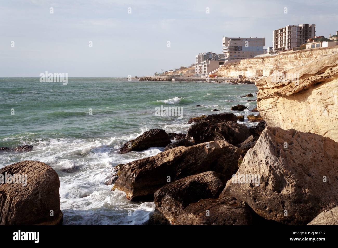 Rocks on the shore of the Caspian Sea. 09 October 2019 year. Aktau city. Kazakhstan Mangistau region. Stock Photo