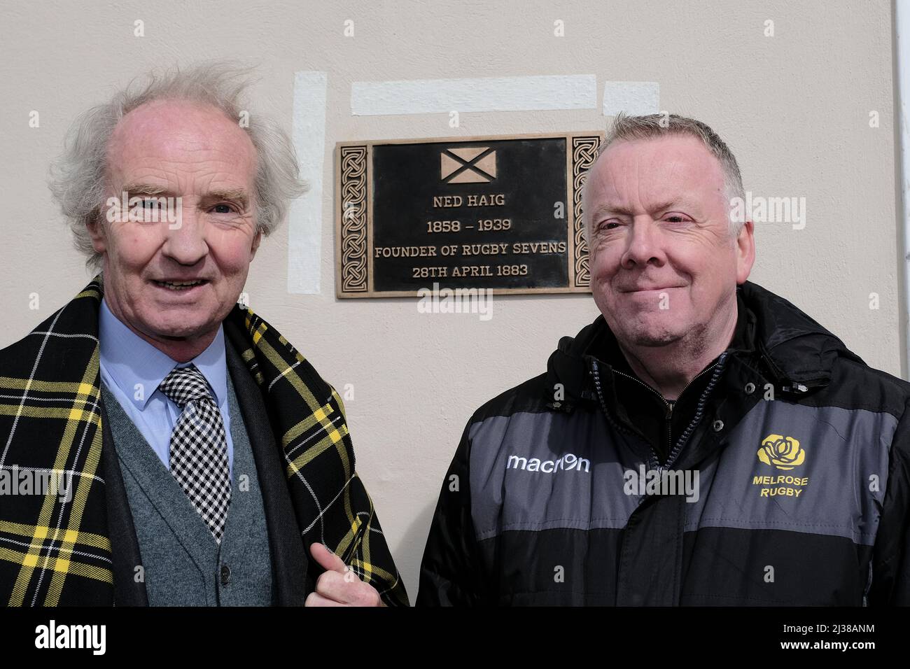 Melrose, UK, Wednesday 06 April 2022 His Grace The Duke of Buccleuch and Queensberry KT KBE CVO DL FSA FRSE FRSGS unveils a plaque. Alongside Douglas Brown, President, Melrose RFC. Melrose Rugby Ltd is delighted to confirm that Ned Haig, the founder of Rugby Sevens, has been recognised by Historic Environment Scotland (HES) in their latest Commemorative Plaque scheme. The national scheme, which has been running since 2012, celebrates noteworthy individuals from Scottish public life, as nominated by the public, by erecting plaques on buildings with strong links to their life or work. The new Stock Photo