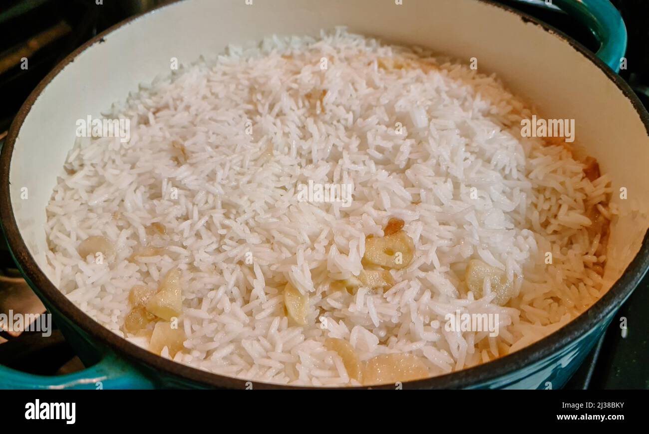 White rice cooked with garlic Stock Photo - Alamy