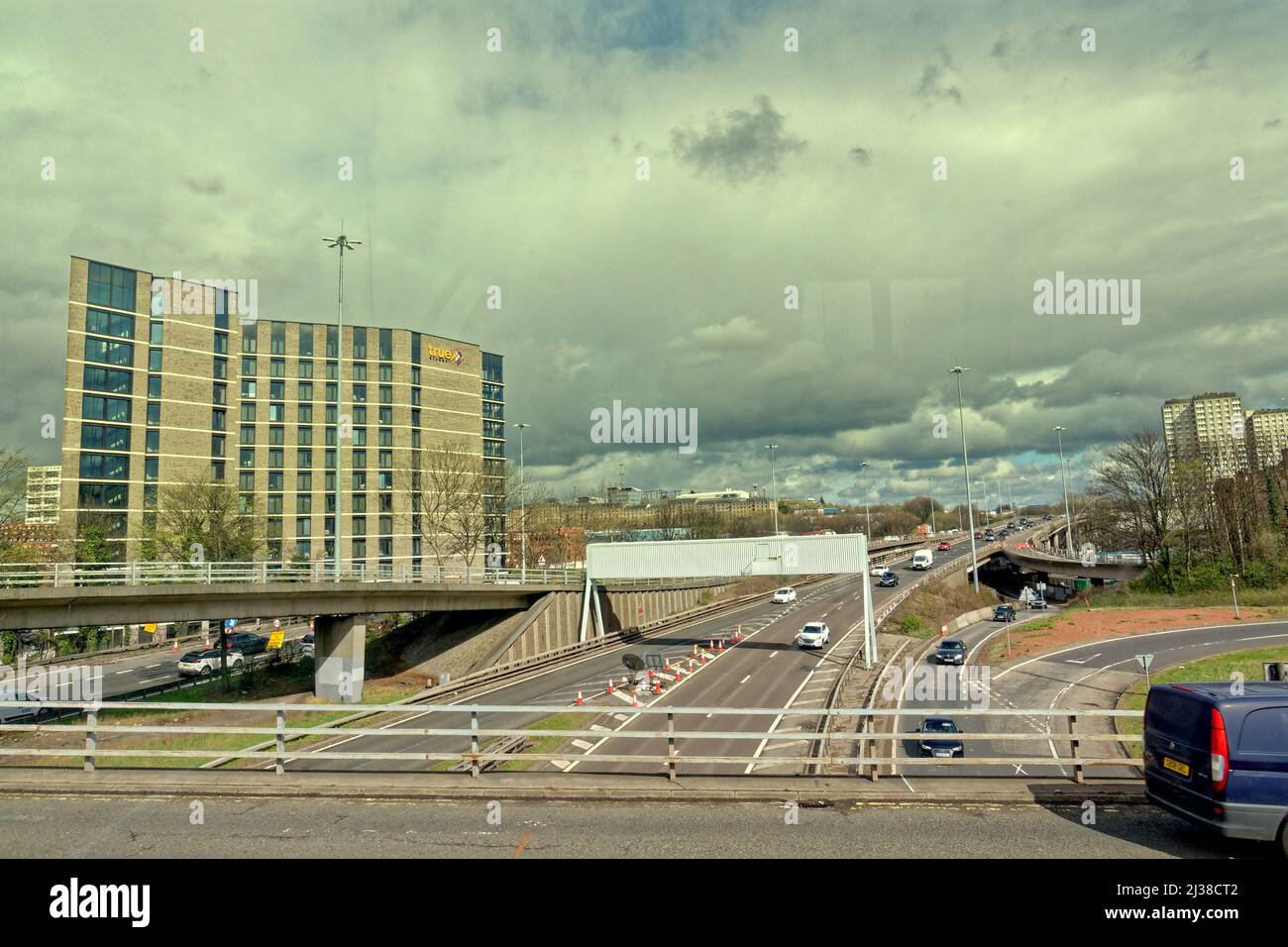 Glasgow, Scotland, UK 6th  April, 2022. UK  Weather: :  Changeable weather saw people take to the streets wary of a change in conditions. The m8 at georges cross.  Credit Gerard Ferry/Alamy Live News Stock Photo
