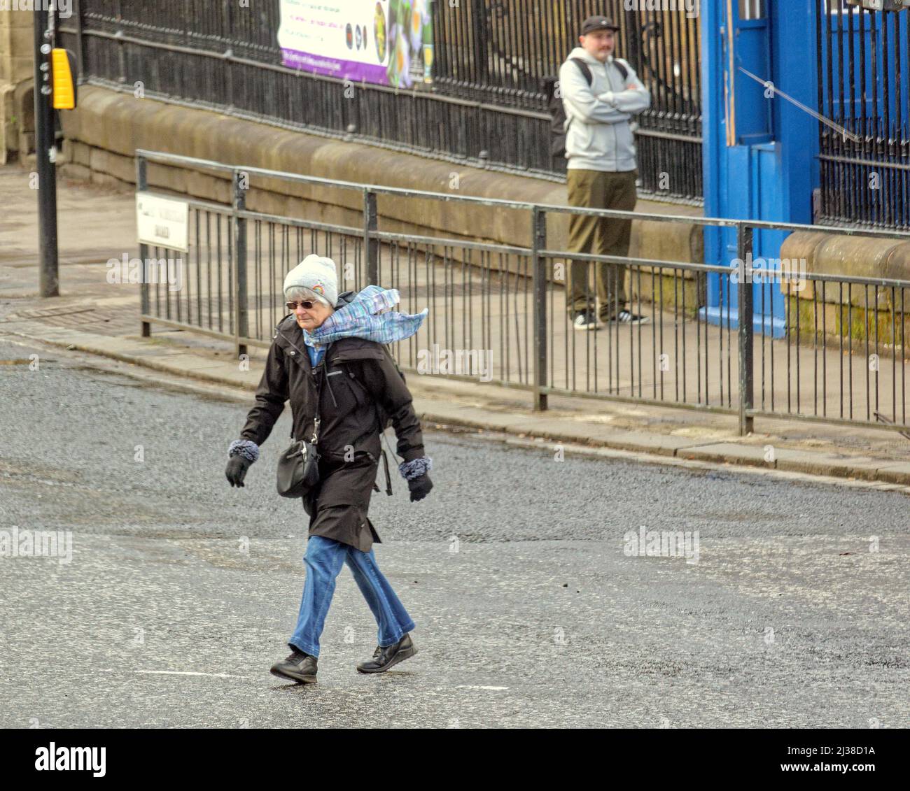 Glasgow, Scotland, UK 6th  April, 2022. UK  Weather: :  Windy at the corner of the byres road and the botanics. Changeable weather saw people take to the streets wary of a change in conditions. Credit Gerard Ferry/Alamy Live News Stock Photo