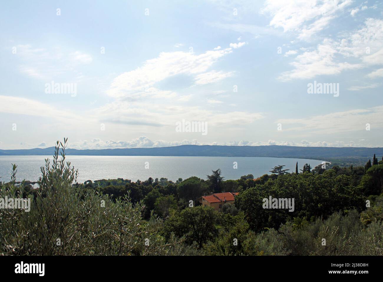 A panoramic view of Lake Trasimeno with trees in the south of Italy Stock Photo