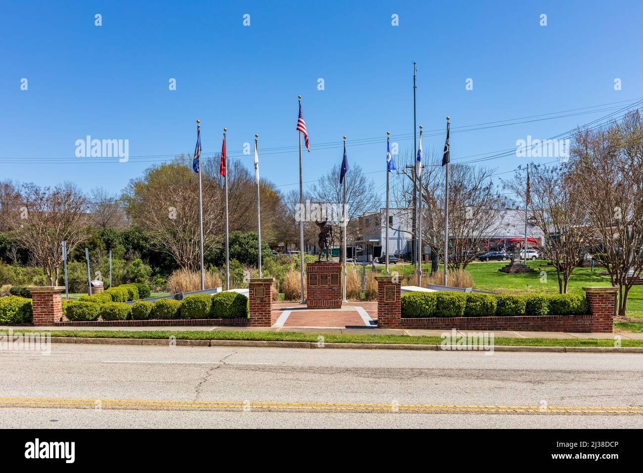 FORT MILL, S.C.-2 APRIL 22: Veterans Park in downtown, with monument and flag poles. Stock Photo